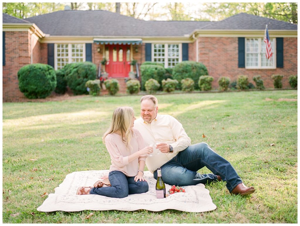 couple having a picnic on front lawn
