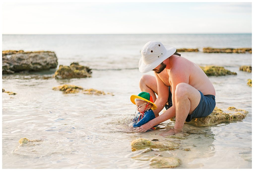 father and son playing in the water on turks and caicos