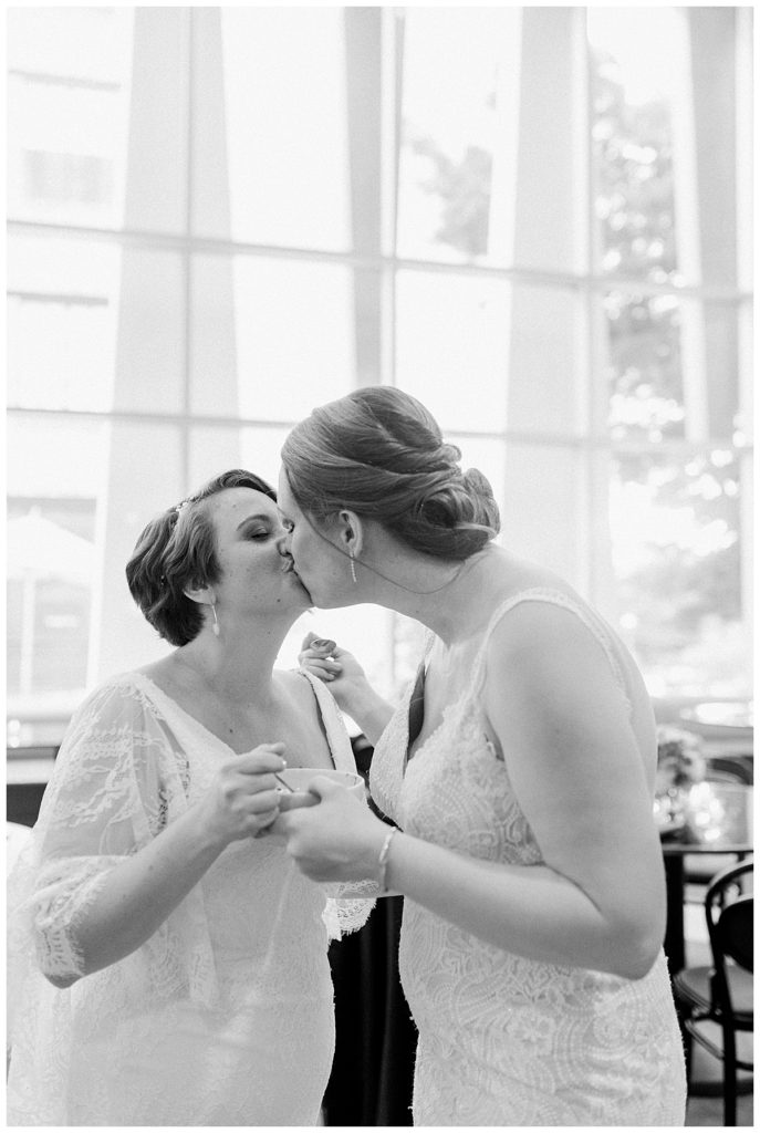 brides kissing at the durham hotel reception