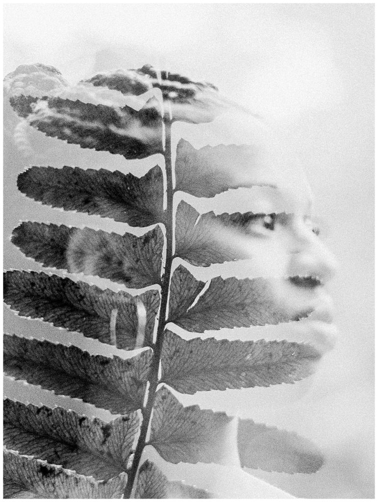double exposure of woman and leaf in black and white film