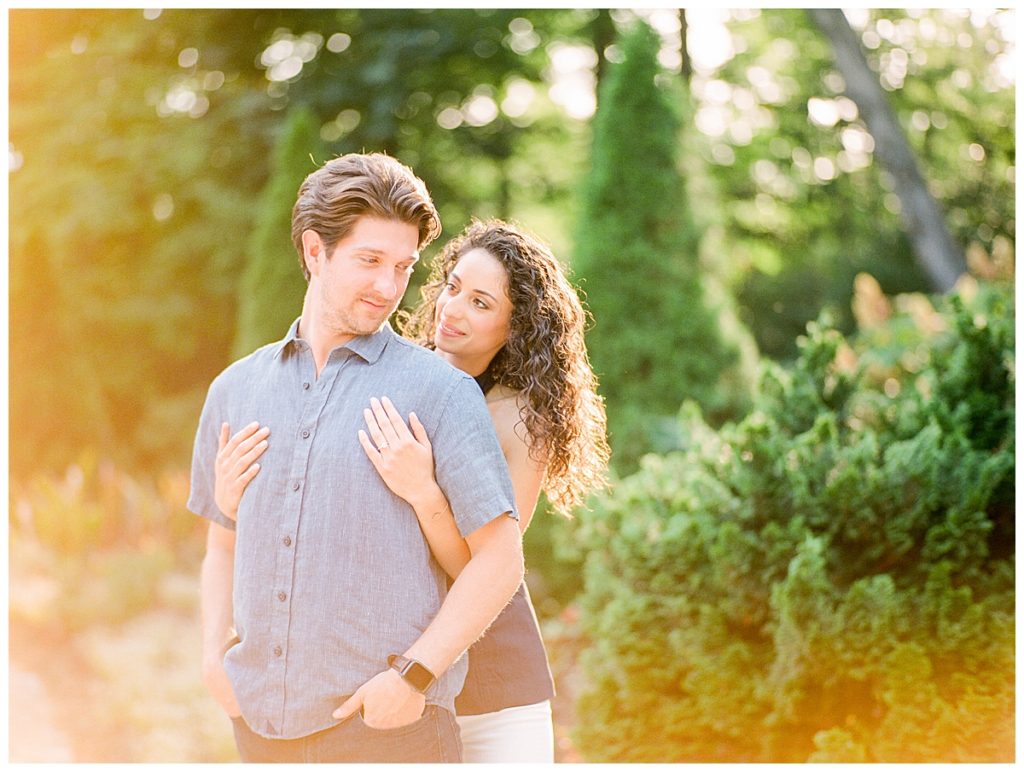 couple embracing at engagement session in durham, nc