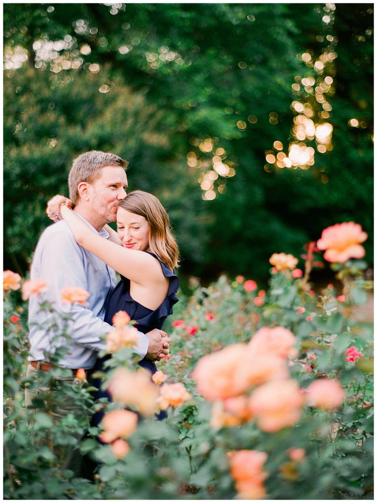 couple hugging engagement session raleigh rose garden