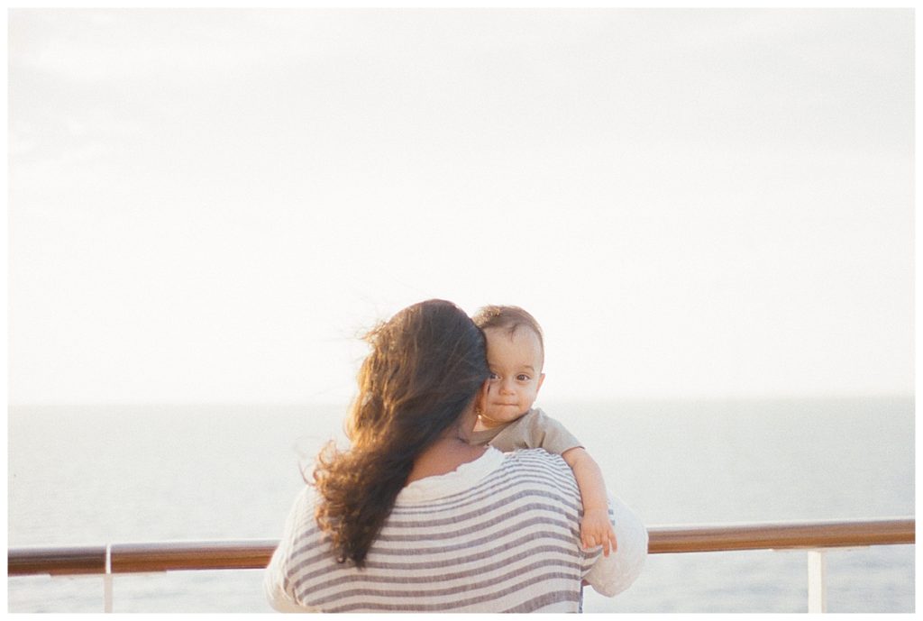 mom and baby on a cruise at sunset