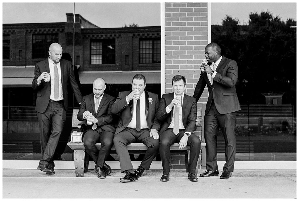 groom with groomsmen american tobacco campus durham nc