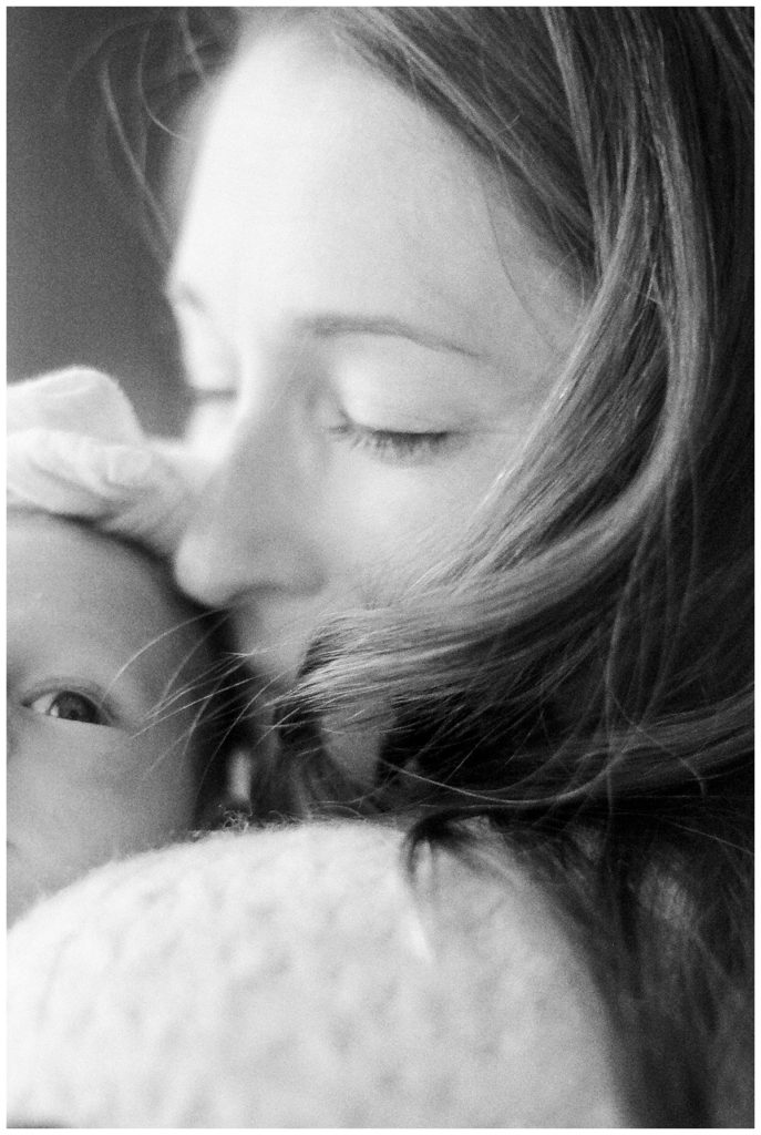 black and white mom holding newborn