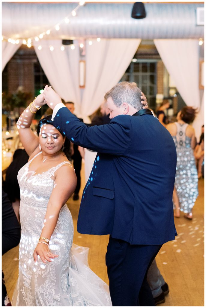 bride and groom dancing at rickhouse
