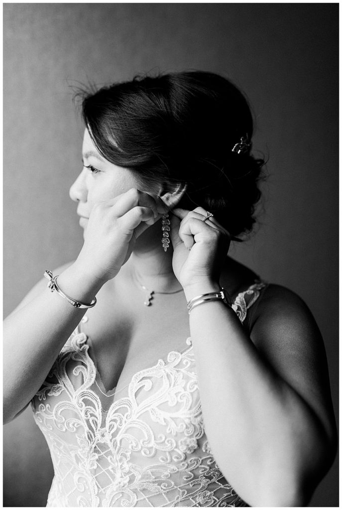 bride in black and white getting ready for wedding day