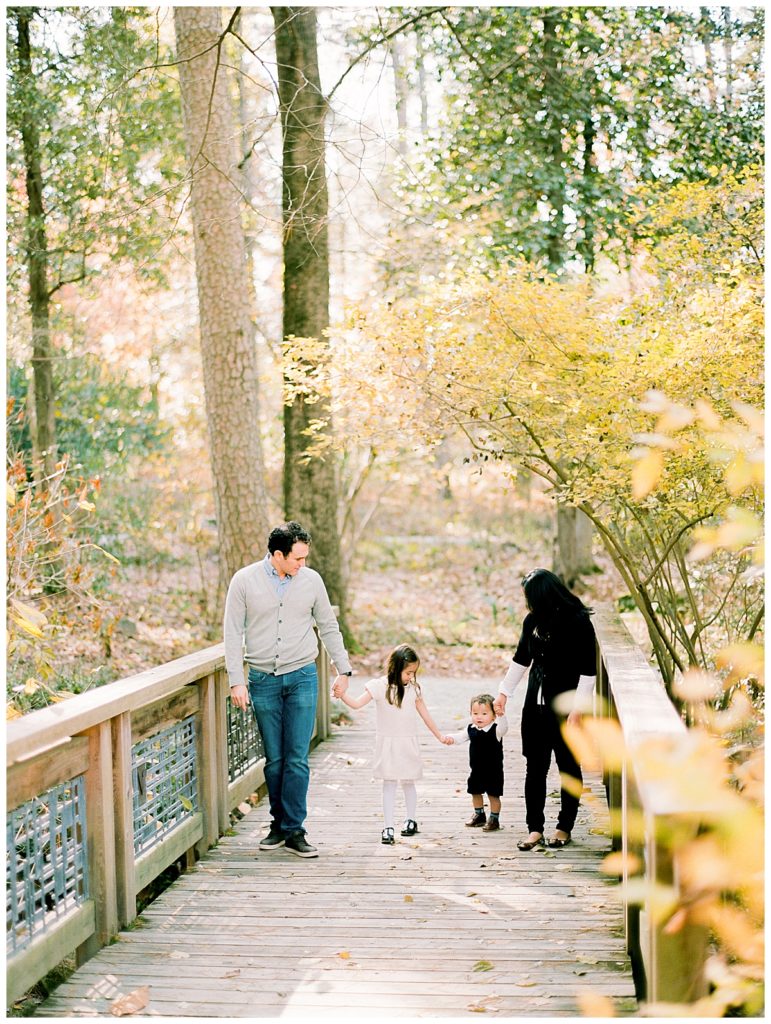 family walking together in duke gardens in the fall