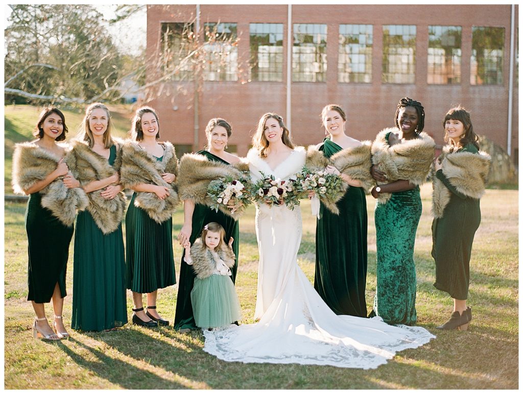 bride with bridal party at forest hall at chatham mills