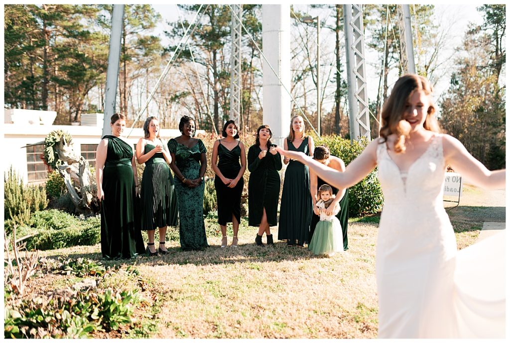 bridesmaids see bride for the first time in dress