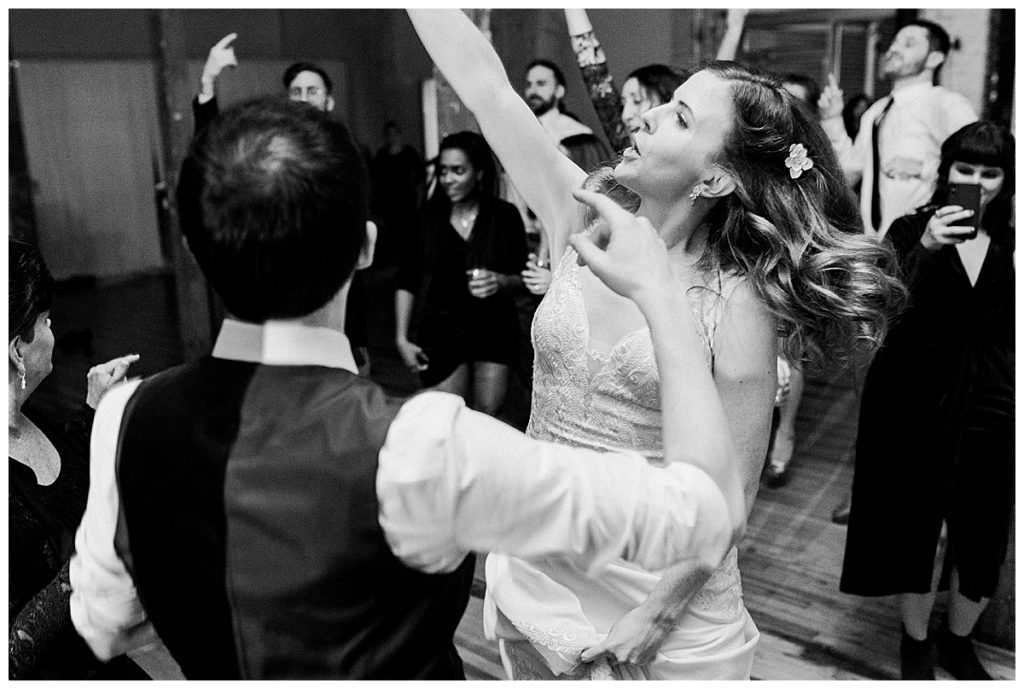 bride and groom dancing at forest hall at chatham mills