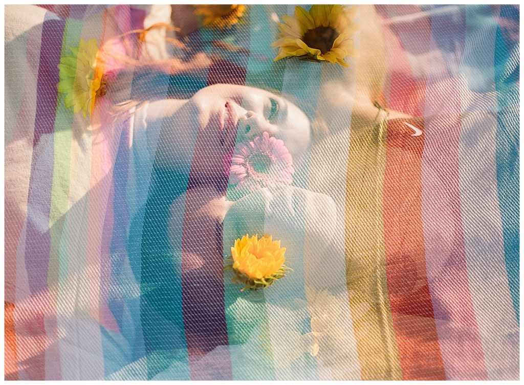 couple lying in rainbow blanket double exposure