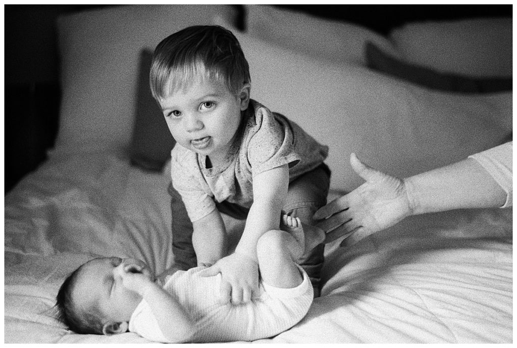 big brother with baby black and white film