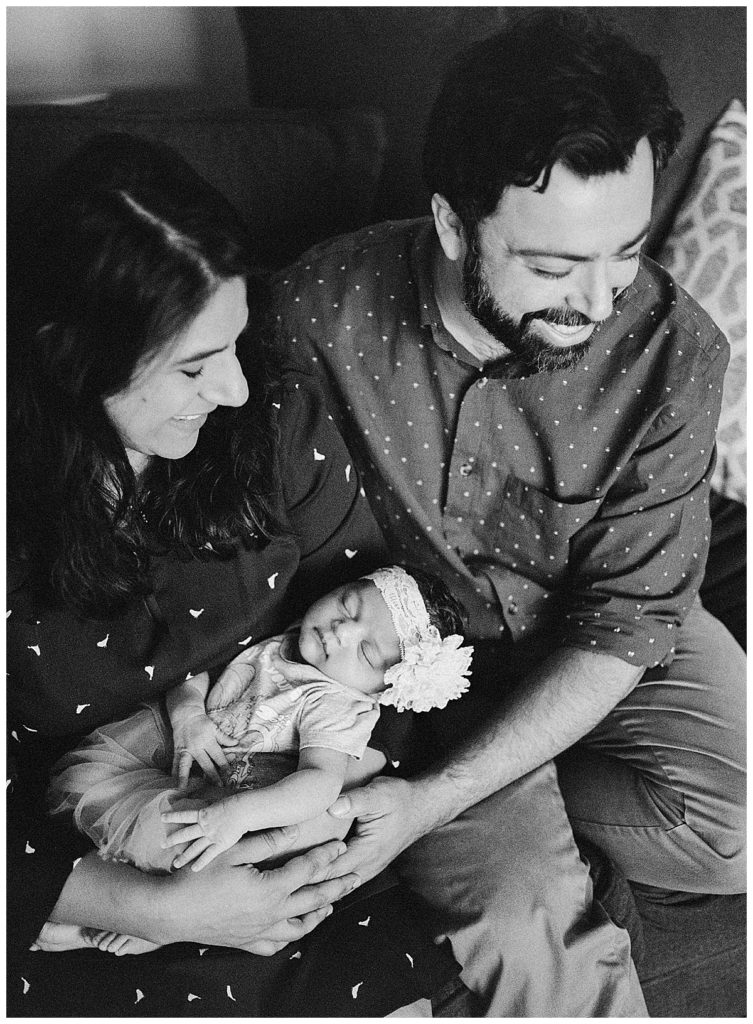 parents with newborn black and white photo