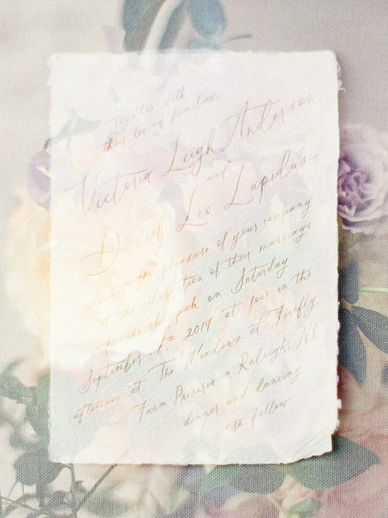 calligraphy wedding invitation double exposed with flowers