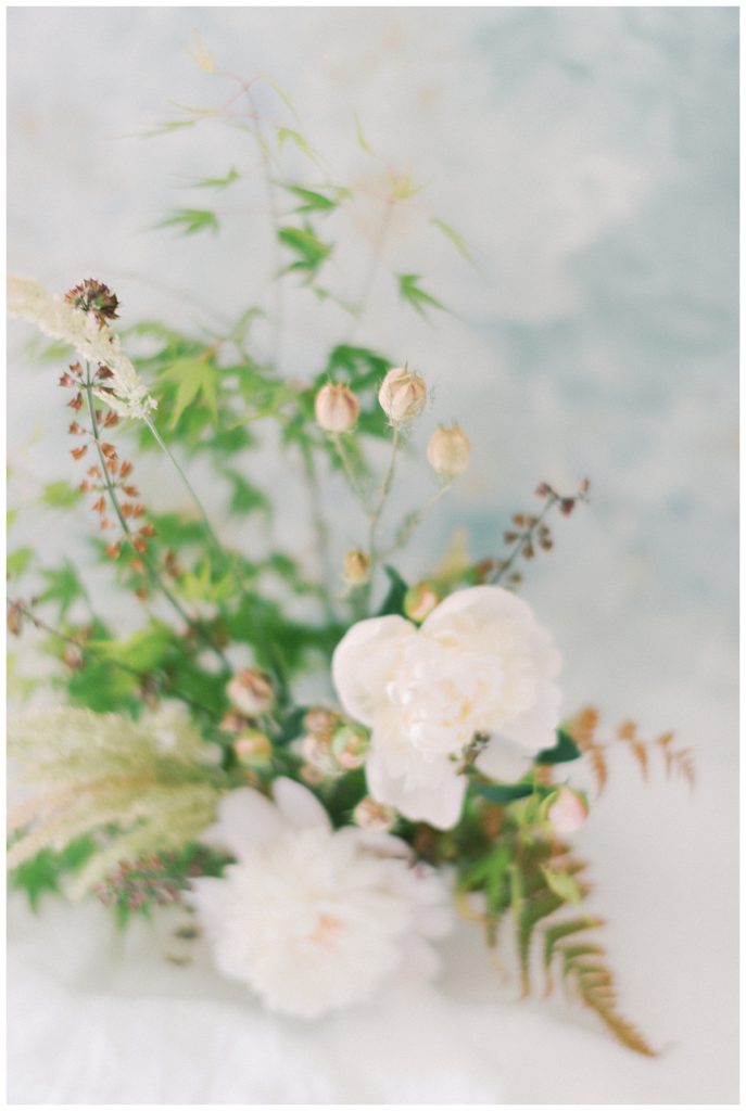 peonies in wedding arrangement