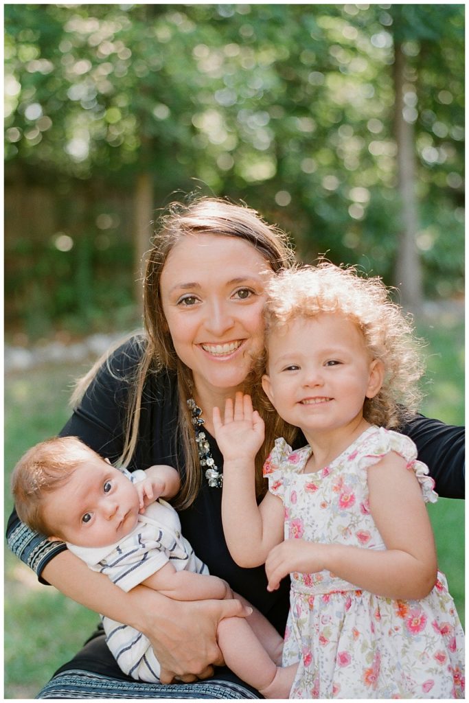 big sister with mom and baby brother