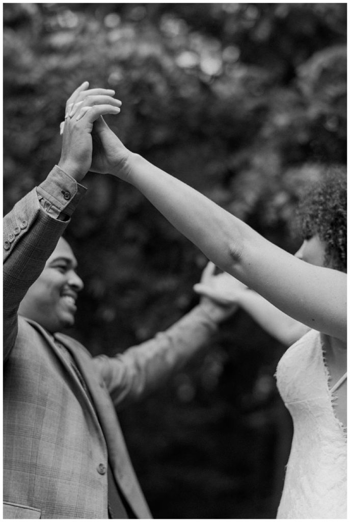 bride and groom dancing black and white image