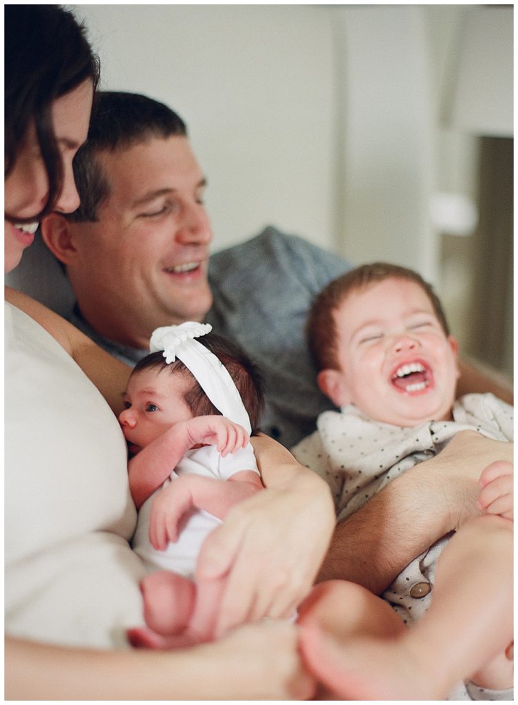 family photo laughing in bed