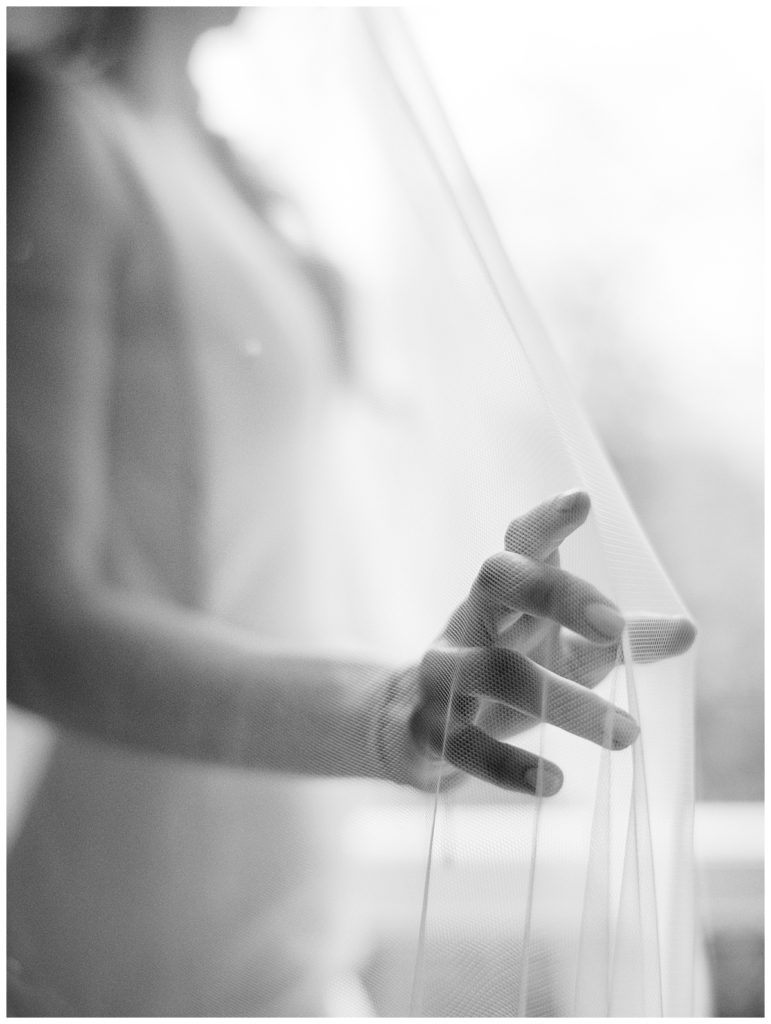 Black and white photo of bride's veil