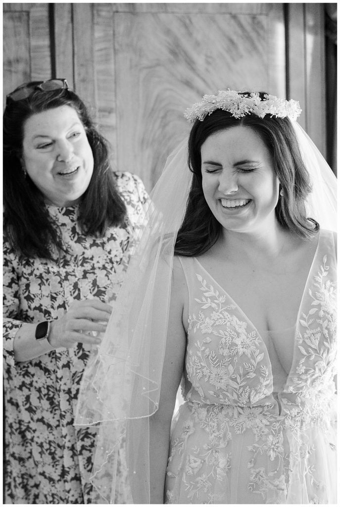 bride laughing with mom