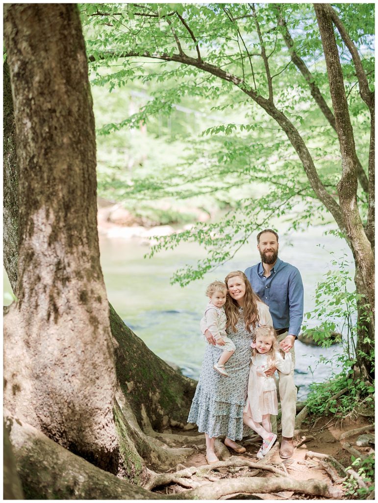 family on banks of eno river