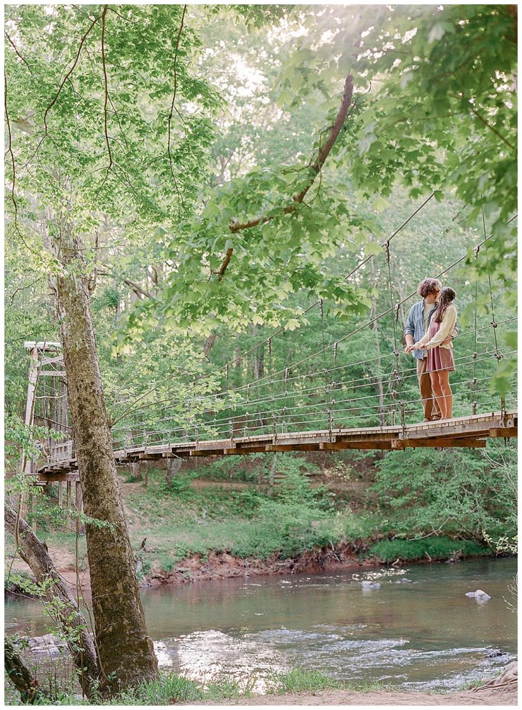 engaged couple on hanging bridge