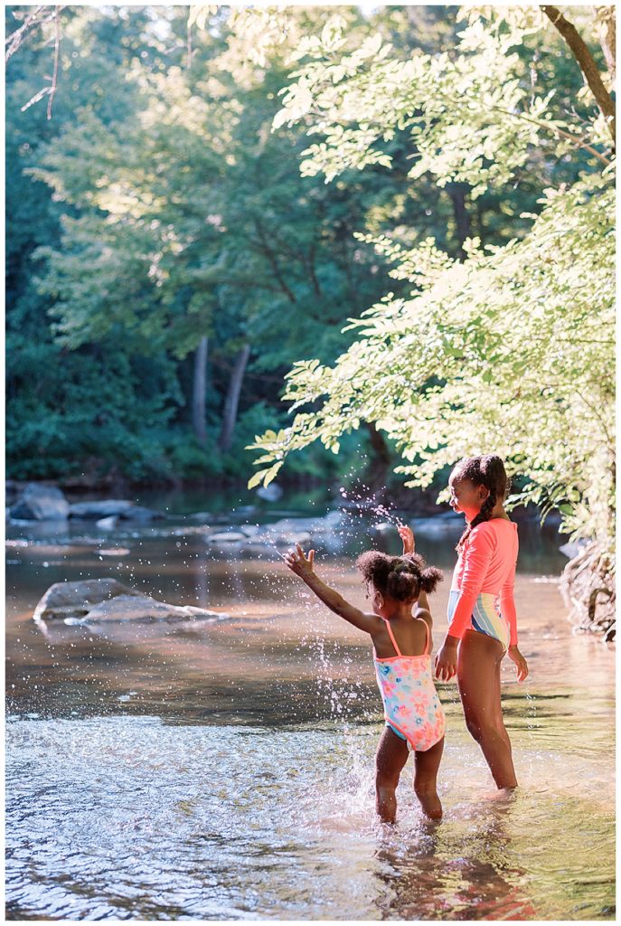 sisters playing in the eno river