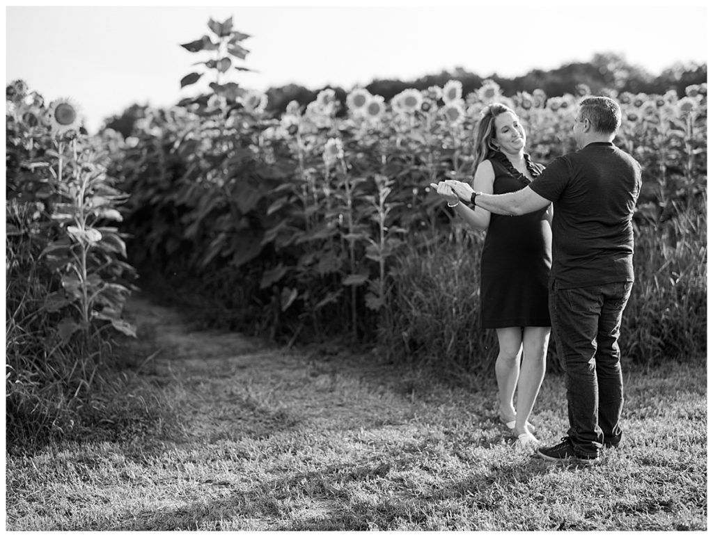 Couple dancing in sunflower field