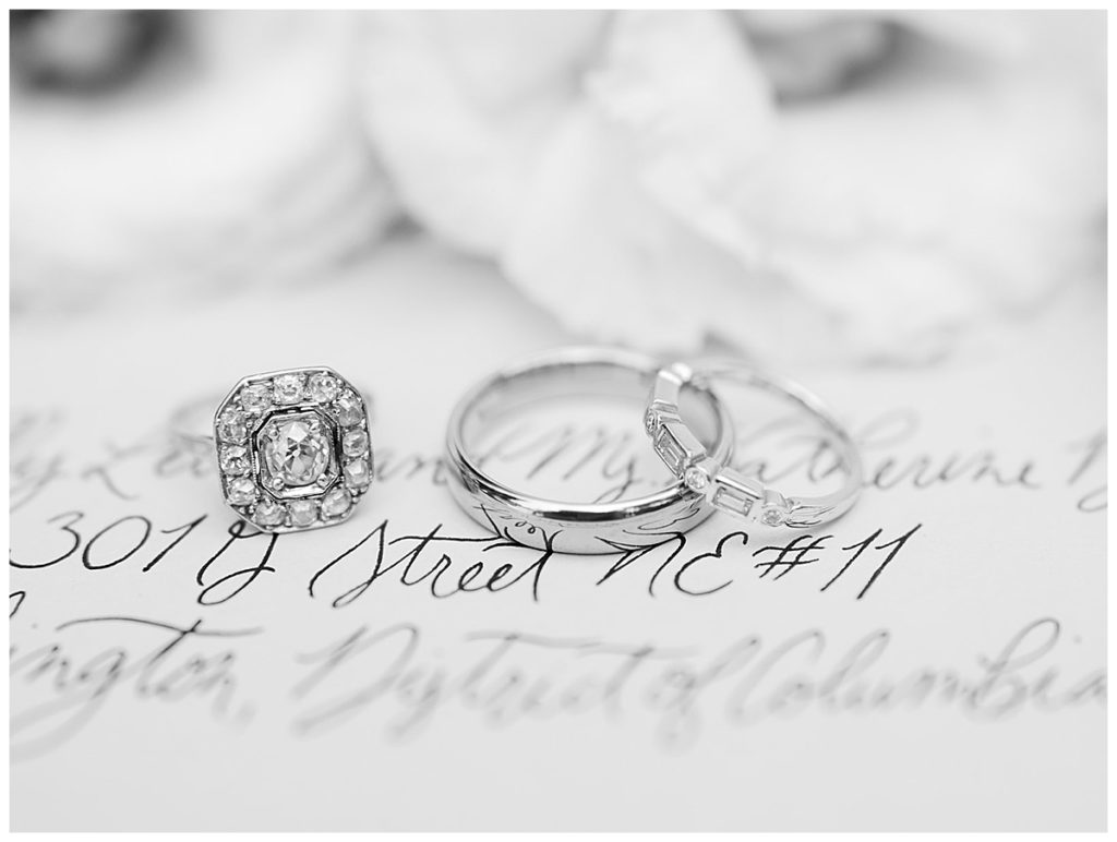 black and white photo of wedding rings