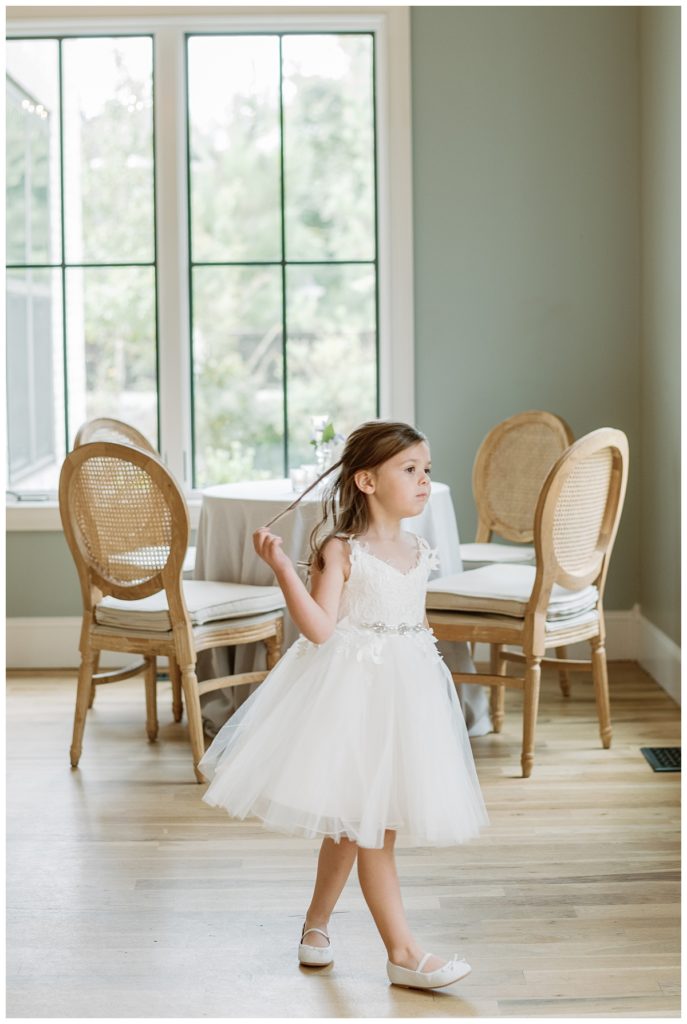 flower girl watching guests arrive