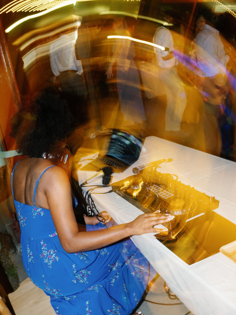 image of dj at wedding taken with motion and light blur